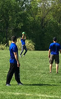 three players playing with ball